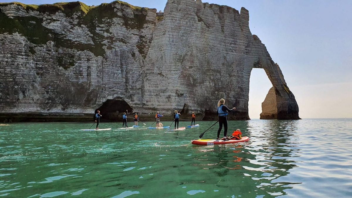 Go along the arches of Etretat on a paddle board